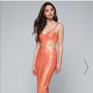 Form fitting Bebe coral bandage dress w/ zip back.